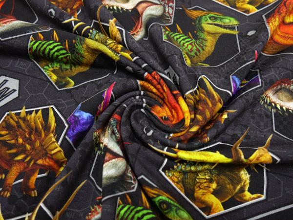 Stoff Baumwolle Jersey mit Jurassic World Dinos Dinosaurier T-Rex Raptor Design grau orange grün blau bunt Lizenzstoff Kinderstoff Kleiderstoff