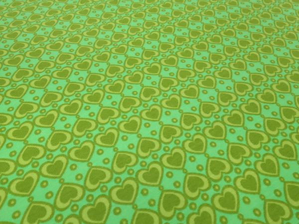 Fabric cotton jersey with hearts dots design in green kiwi olive dress fabric children's fabric