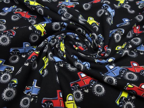 Stoff Baumwolle Jersey Monster Truck Autos Design schwarz rot blau gelb bunt Kinderstoff Kleiderstoff