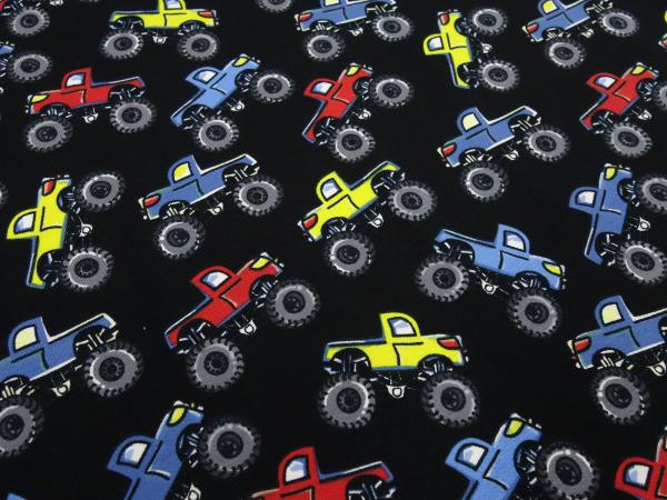 Stoff Baumwolle Jersey Monster Truck Autos Design schwarz rot blau gelb bunt Kinderstoff Kleiderstoff